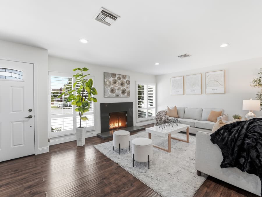Living room with fireplace and wood look flooring